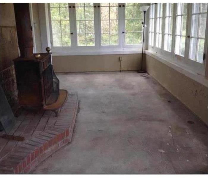 Room with dry concrete floor.