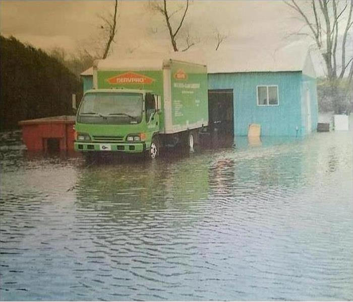 SERVPRO truck in a flooded road.